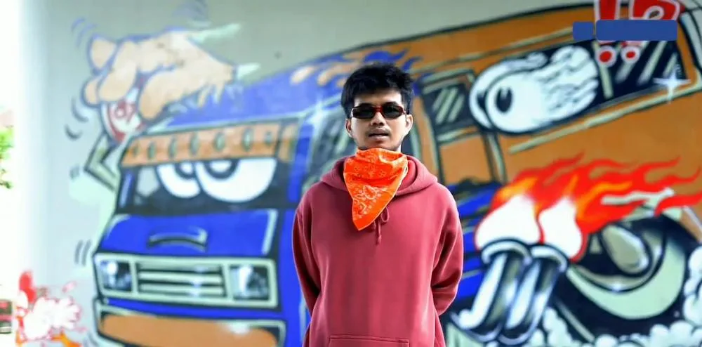 Michael Evan, Pembuat Grafiti Angkot di Jembatan Kedungkandang yang Punya Keterbatasan Melihat Warna