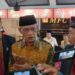 Ketua Umum PP Muhammadiyah KH Haedar Nashir (baju kuning)