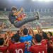 Pelatih Timnas Indonesia Shin Tae Yong saat dilempat oleh seluruh pemain sebagai perayaan lolosnya Timnnas Indonesia ke fase selanjutnya Asian Cup U-20 Qualifiers di Stadion Gelora Bung Tomo, Surabaya, Minggu (18/9/2022).
