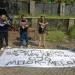 Tim Gabungan Aremania menunjukkan pencopotan spanduk provokatif di Malang.