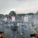 Teatrikal penembakan gas air mata oleh aparat dalam aksi 40 hari Tragedi Kanjuruhan.