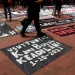 Spanduk tuntutan keadilan bagi korban Tragedi Kanjuruhan.