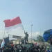 Aremania melakukan aksi menuntut keadilan bagi korban Tragedi Kanjuruhan.