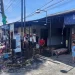 Petugas Damkar Kabupaten Malang melakukan penanggulangan kebakaran di kios handphone dan bensin di Pakis.