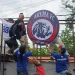 Aremania melakukan pemasangan kembali Logo Arema di Kandang Singa.
