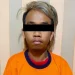 Tersangka AK (24) setelah ditahan di Polsek Singosari.