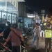 Para petugas mengamankan sepeda motor yang digunakan untuk balap liar di Lawang.