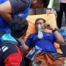 Petugas mendapat pertolongan alat bantu pernafasan karena sesak nafas usai berjibaku dengan api.