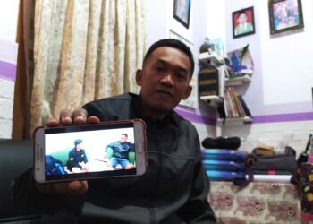 Ketua RT 02 RW 03 Wonocari, Pesanggrahan Sri Kustiyo Basuki menunjukkan foto korban.