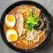 Gurih nikmat kuah ramen berpadu telur setengah matang dan aneka toping.