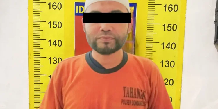 Tersangka UF usai diamankan pihak kepolisian.