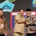 Bupati Malang, Sanusi saat menerima penghargaan UHC, Maret 2023 lalu.