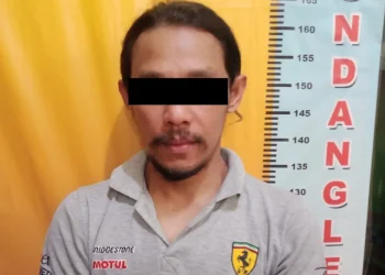 AG, tersangka penganiayaan yang sempat buron kini diamankan polisi.