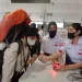 Pengguna memasuki pintu loket pemeriksaan tiket di Stasiun Kota Malang.