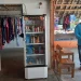 Sejak warungnya dialiri listrik, Tuti menyediakan minuman dingin di kulkas.