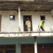 Petugas melakukan penangulangan kebakaran di rumah Siti Rosidah.
