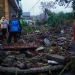 Hujan deras mengakibatkan tembok Hotel Singhasari Kota Batu sepanjang 30 meter di Jalan Darmin 14, Desa Beji, Kota Batu roboh.