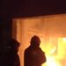 Petugas memadamkan api yang membakar gudang plastik di Pakis.