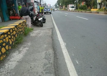 Lokasi bus tabrak sepeda motor di Singosari.