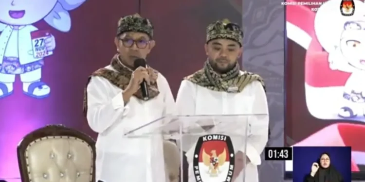 Calon Wali Kota Batu, Nurochman sebut angka pengangguran terbuka di Kota Batu sebesar 4, 52 persen pada tahun 2023 dalam Debat Publik Ketiga Pilkada Kota Batu 2024, Kamis (21/11/2024) malam kemarin. /Foto: Tangkapan layar YouTube KPU Kota Batu.