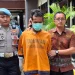 Tersangka pembunuhan di Desa Jenggolo, Kecamatan Kepanjen saat digelandang di Polres Malang. Foto: Aisyah Nawangsari Putri