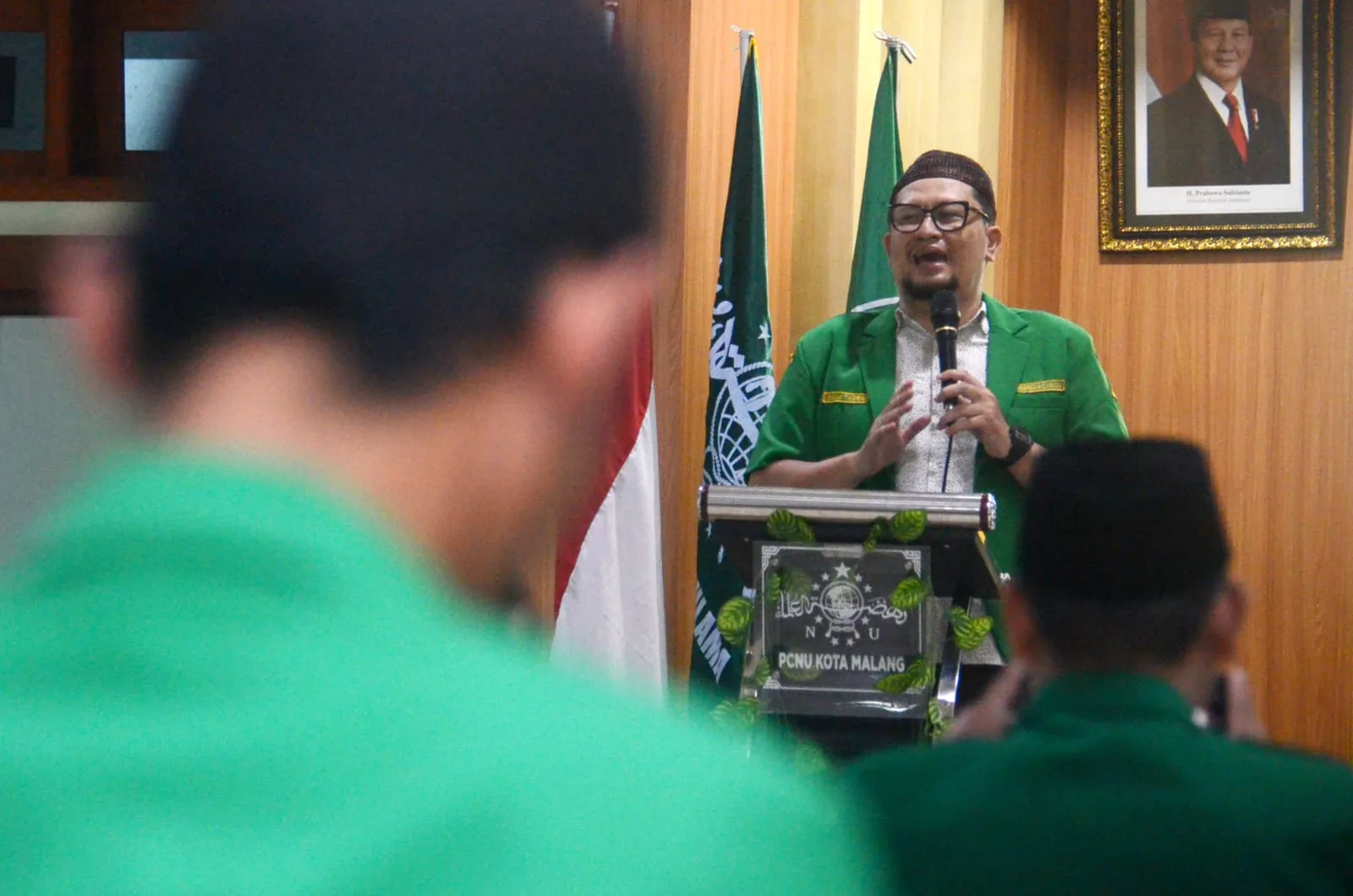 Ketua Badan Siber Ansor (BSA) Kota Malang Irham Thoriq dalam menyampaikan sambutan. Foto/Aditya Hendra