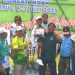 Alika Naila Putri, atlet cilik loncat indah Kota Batu digendong usai meraih medali emas Porprov Jatim 2025 pertamanya. Foto: KONI Kota Batu