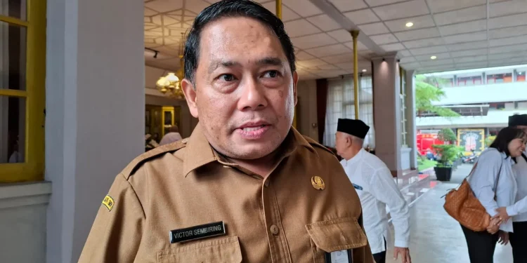 Kepala Dinas Perikanan Kabupaten Malang, Victor Sembiring, saat menjelaskan tentang kampung nelayan mera putih. Foto: Aisyah Nawangsari Putri