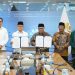 Rektor Unisma, Prof. Drs. Junaidi, M.Pd, Ph.D (empat dari kanan) dan Menteri P2MI, Mukhtarudin (tiga dari kiri) sepakat menjalin kerja sama dalam upaya meningkatkan kompetensi dan juga perlindungan pekerja migran Indonesia. /Foto: Dok. Istimewa.