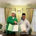 Dr Isroqunnajah MAg bersama Albir Krganov. Foto/dok UIN Malang