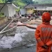Proses penanganan bencana longsor yang melanda Kolam Pemandian Dewi Sri di Pujon, Malang. Foto: BPBD Kabupaten Malang