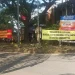 Banner penolakan warga atas keberadaan toko miras di kawasan Sawojajar, Kota Malang. (Foto/M Sholeh)