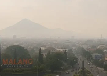 Prakiraan cuaca Malang, terutama di wilayah Kota Malang pada Sabtu, 30 Mei 2026 dalam kondisi berawan dan udara kabur. /Foto: Ilustrasi dibuat dengan AI.